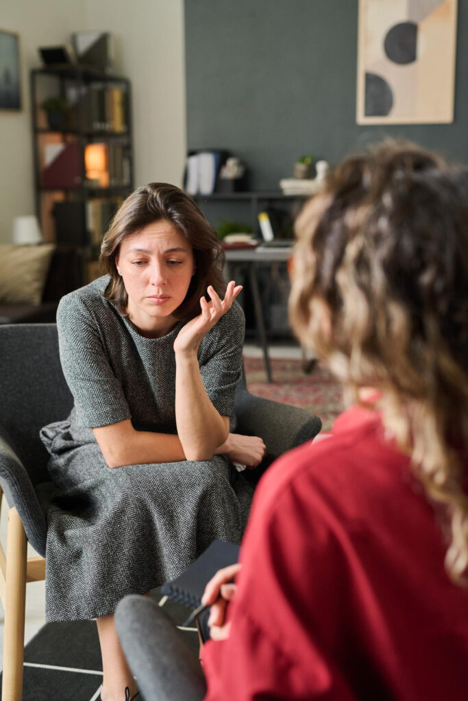 Adult receiving neuroscience-informed OCD therapy combining talking therapy and neurofeedback in London